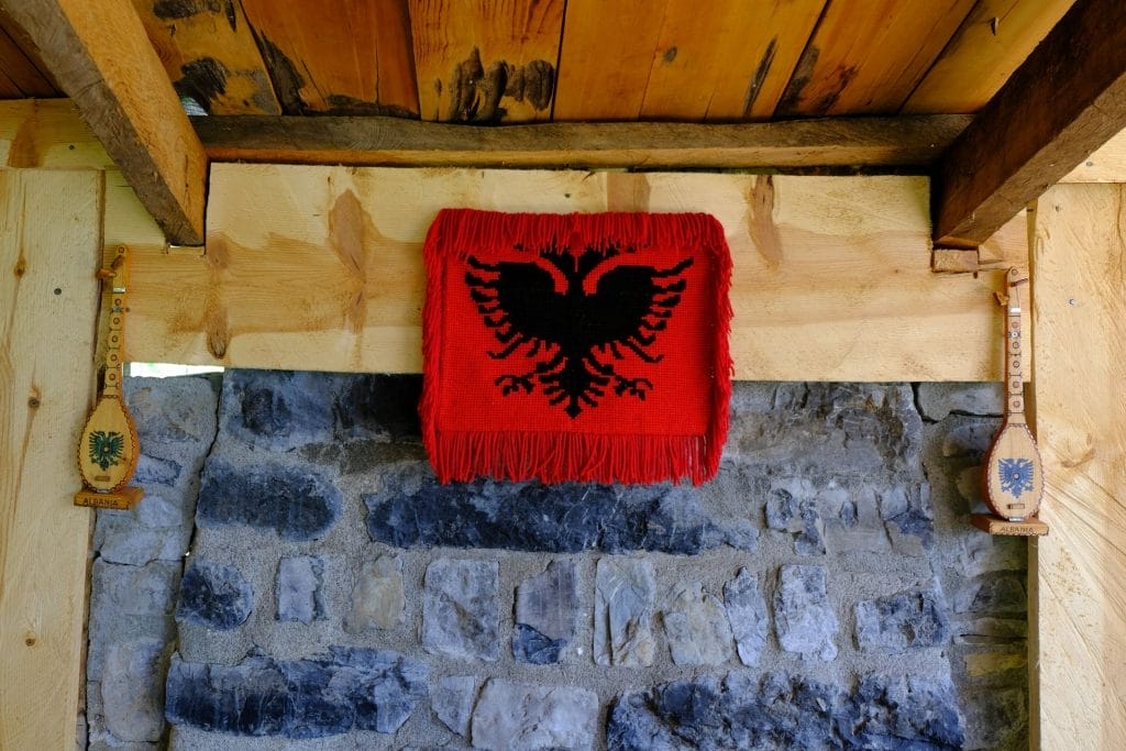 Albanian flag on wall in mountain coffeehouse