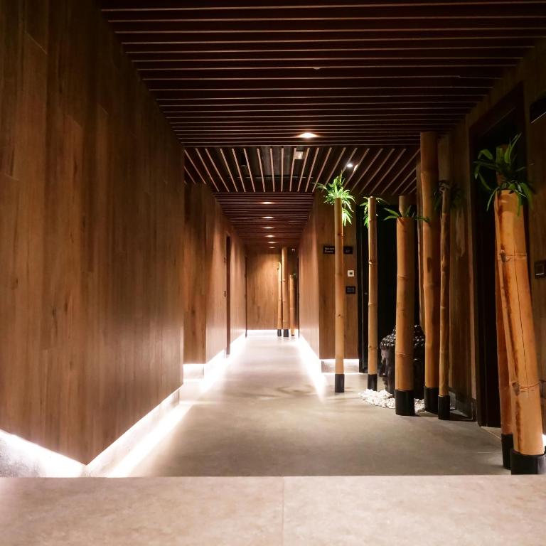Select Hill Resort a hallway with wooden walls and a light