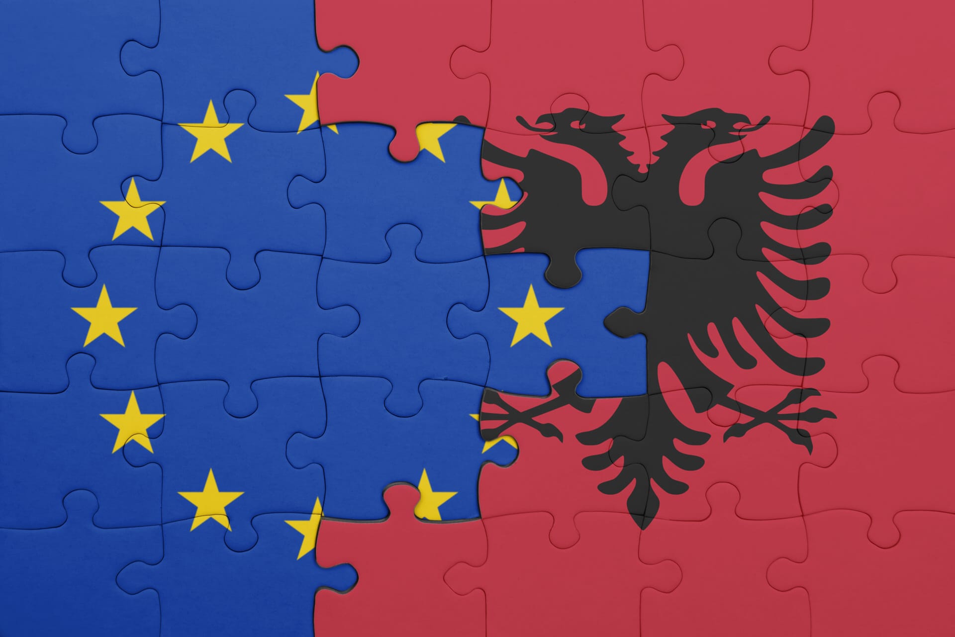 puzzle with the colourful national flag of albania and flag of european union.